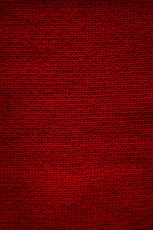 Red fabric texture background. Texture of red sweaterの写真素材