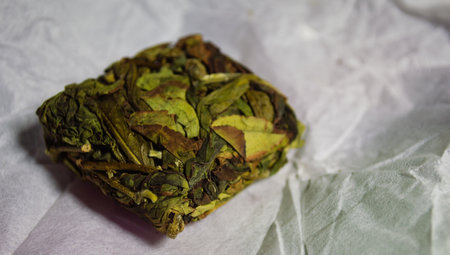 Pressed briquette of Oolong tea in a white package