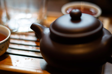 A clay teapot for a tea ceremony on a tea board