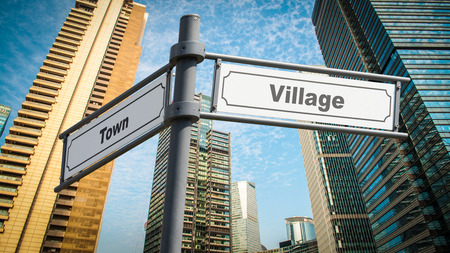 Street Sign Village versus Townの写真素材
