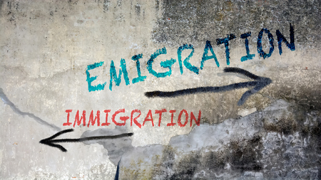 Street Graffiti Emigration versus Immigrationの写真素材