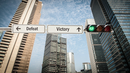 Street Sign Victory versus Defeatの写真素材