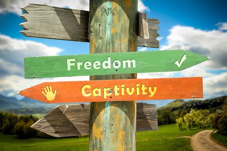 Street Sign the Direction Way to Freedom versus Captivity