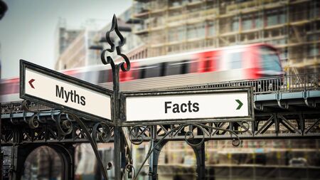 Street Sign the Direction Way to Facts versus Mythsの写真素材