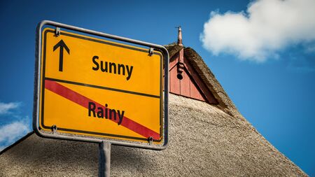 Street Sign the Direction Way to Sunny versus Rainyの写真素材