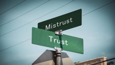 Street Sign the Direction Way to Trust versus Mistrustの写真素材