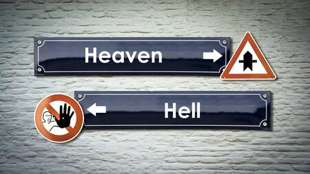 Street Sign the Direction Way to Heaven versus Hellの写真素材