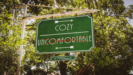 Street Sign the Direction Way to Cozy versus Uncomfortableの写真素材