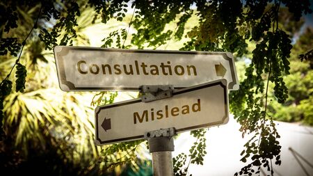 Street Sign the Direction Way to Consultation versus Misleadの写真素材