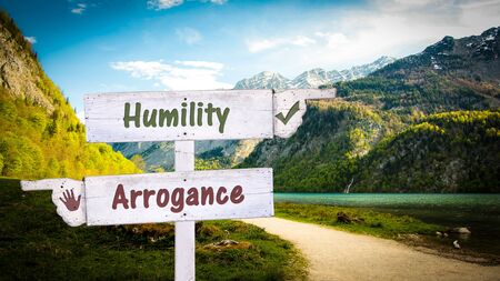 Street Sign the Direction Way to Humility versus Arroganceの写真素材