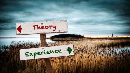 Street Sign the Direction Way to Experience versus Theoryの写真素材