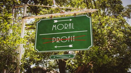 Street Sign the Direction Way to Moral versus Profitの写真素材