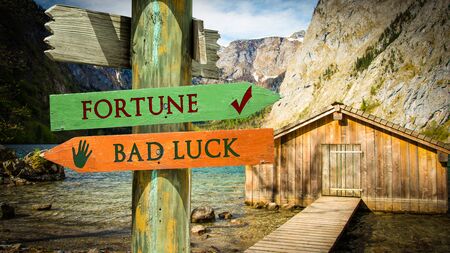Street Sign the Direction Way to Fortune versus Bad Luckの写真素材