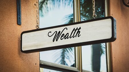 Street Sign theDirection Way to Wealthの写真素材