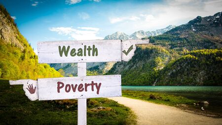 Street Sign the Direction Way to Wealthy versus Povertyの写真素材