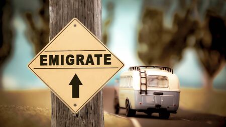 Street Sign the Direction Way to Emigrateの写真素材