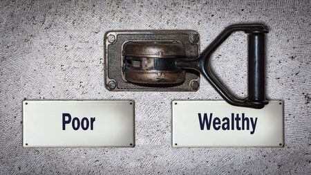Wall Switch the Direction Way to Wealthy versus Poorの写真素材