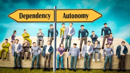Street Sign the Direction Way to Autonomy versus Dependencyの写真素材