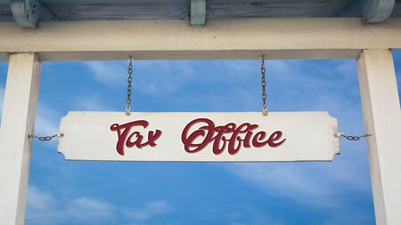 Street Sign the Direction Way to Tax Officeの写真素材