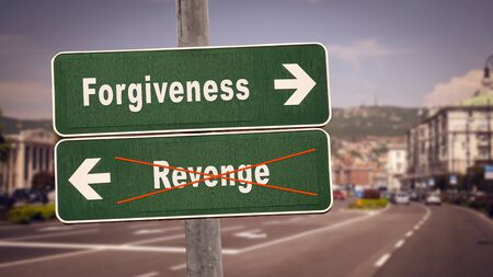 Street Sign the Direction Way to Forgiveness versus Revengeの写真素材