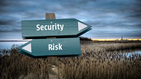 Street Sign the Direction Way to Security versus Riskの写真素材