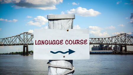 Street Sign the Direction Way to LANGUAGE COURSEの写真素材