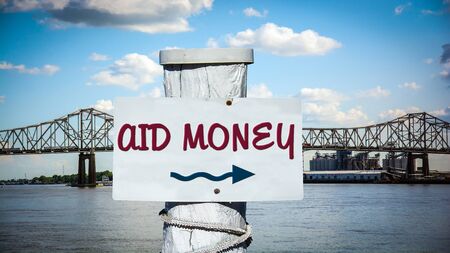 Street Sign the Direction Way to Aid Moneyの写真素材