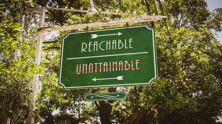 Street Sign the Direction Way to Reachable versus Unattainableの写真素材