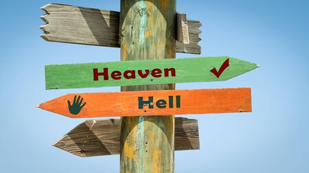 Street Sign the Direction Way to Heaven versus Hellの写真素材