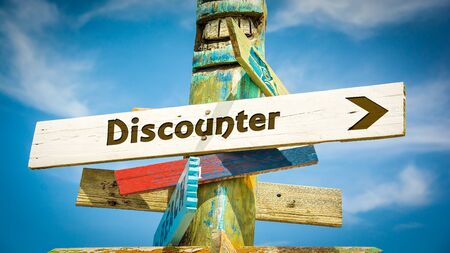 Street Sign the Direction Way to Discounterの写真素材