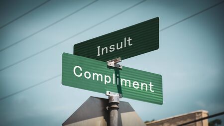Street Sign the Direction Way to Compliment versus Insultの写真素材