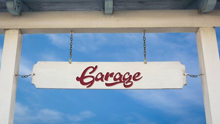 Street Sign the Direction Way to Garageの写真素材