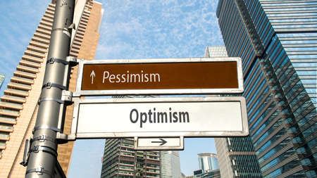 Street Sign the Direction Way to Optimism versus Pessimismの写真素材
