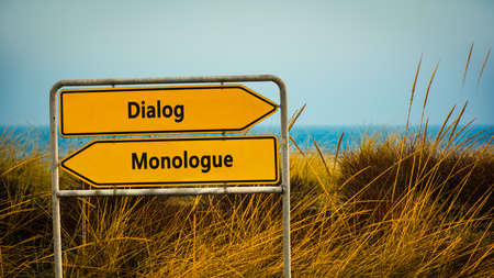 Street Sign the Direction Way to Dialog versus Monologueの写真素材