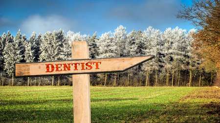 Street Sign the Direction Way to Dentistの写真素材