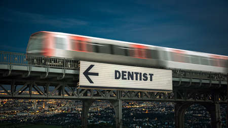 Street Sign the Direction Way to Dentistの写真素材