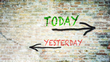 Wall Sign the Direction Way to Today versus Yesterdayの写真素材
