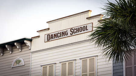 Street Sign the Direction Way to DANCING SCHOOLの写真素材