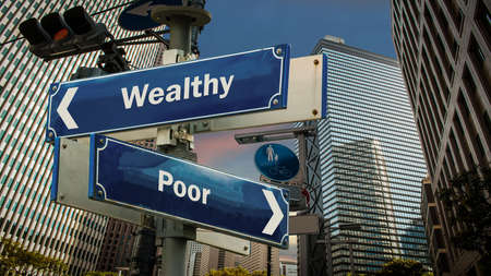 Street Sign the Direction Way to Wealthy versus Poorの写真素材