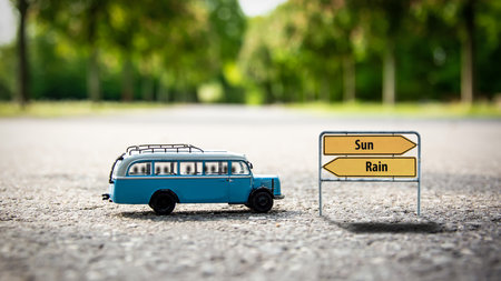 Street Sign the Direction Way to Sun versus Rainの写真素材