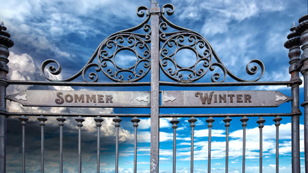An image with a signpost pointing in two different directions in German. One direction points to winter, the other points to summer.の写真素材