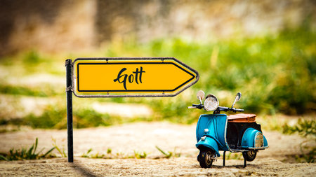 The picture shows a signpost and a sign that points in the direction of God in German.