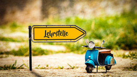 A picture with signposts in the direction of the apprenticeship position in Germanの写真素材