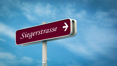 An image with a signpost in German pointing towards a street.の写真素材
