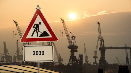 Image of a signpost pointing in the direction of the year 2030の写真素材