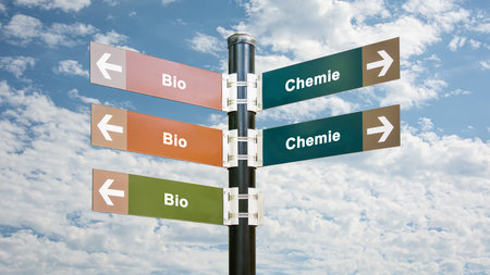 An image with a signpost pointing in two different directions in German. One direction points to Bio, the other points to Chemistry.の写真素材