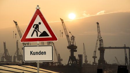 a picture with signposts in the direction of customers in German languageの写真素材
