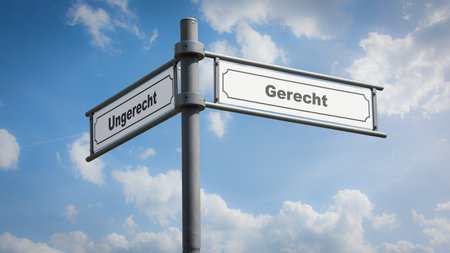 An image with a signpost pointing in two different directions in German. One direction points to righteous, the other points to unrighteous.の写真素材