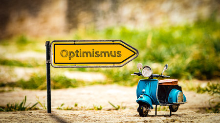 An image of a signpost in German pointing in the direction of optimism.の写真素材