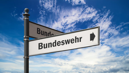 The picture shows a signpost and a sign that points in the direction of the Bundeswehr in German.の写真素材